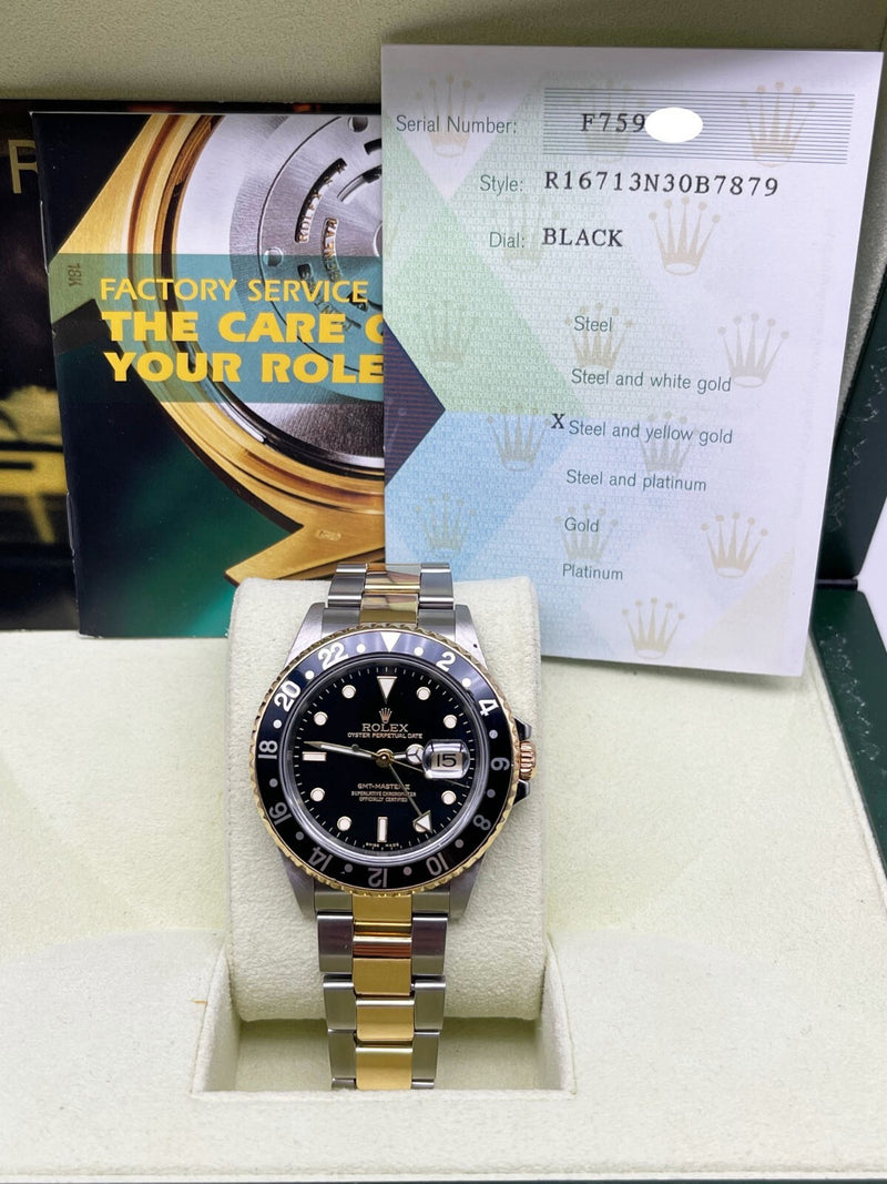 2006 Rolex GMT Master II 16713 Black Dial 18K Yellow Gold Steel 40mm B